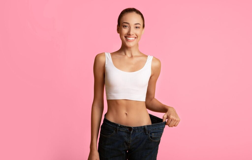 weight loss concept slim girl oversize jeans standing yellow studio background copy space 922936 68806