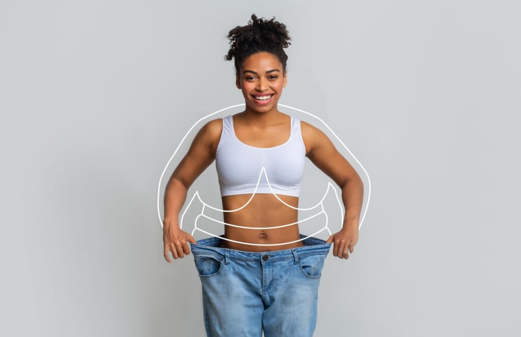 happy young slim african american woman big jeans enjoying weight loss result with abstract lines around body 116547 49909